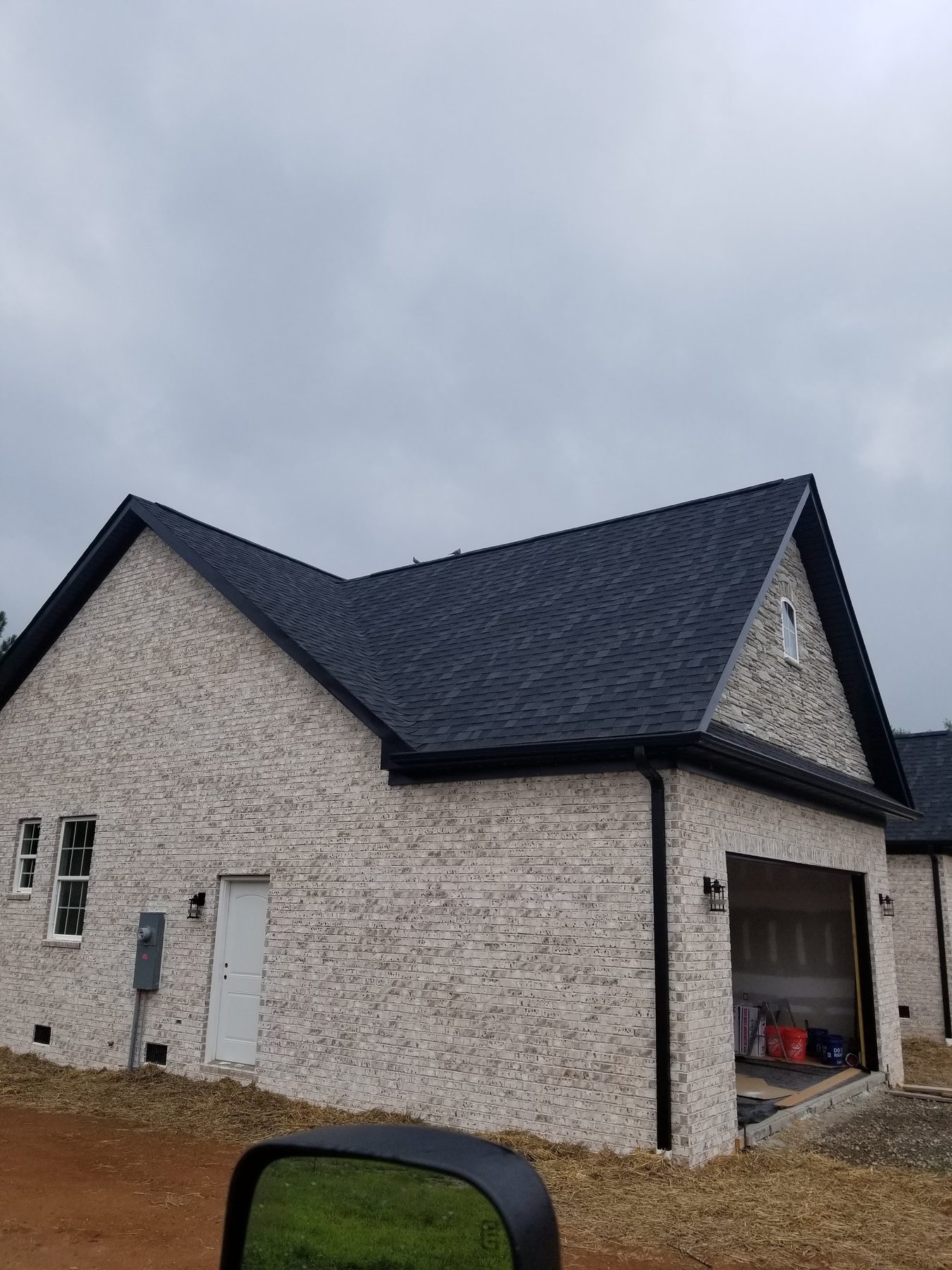 Completed white brick home built by Tessco Construction in Spartanburg County, South Carolina