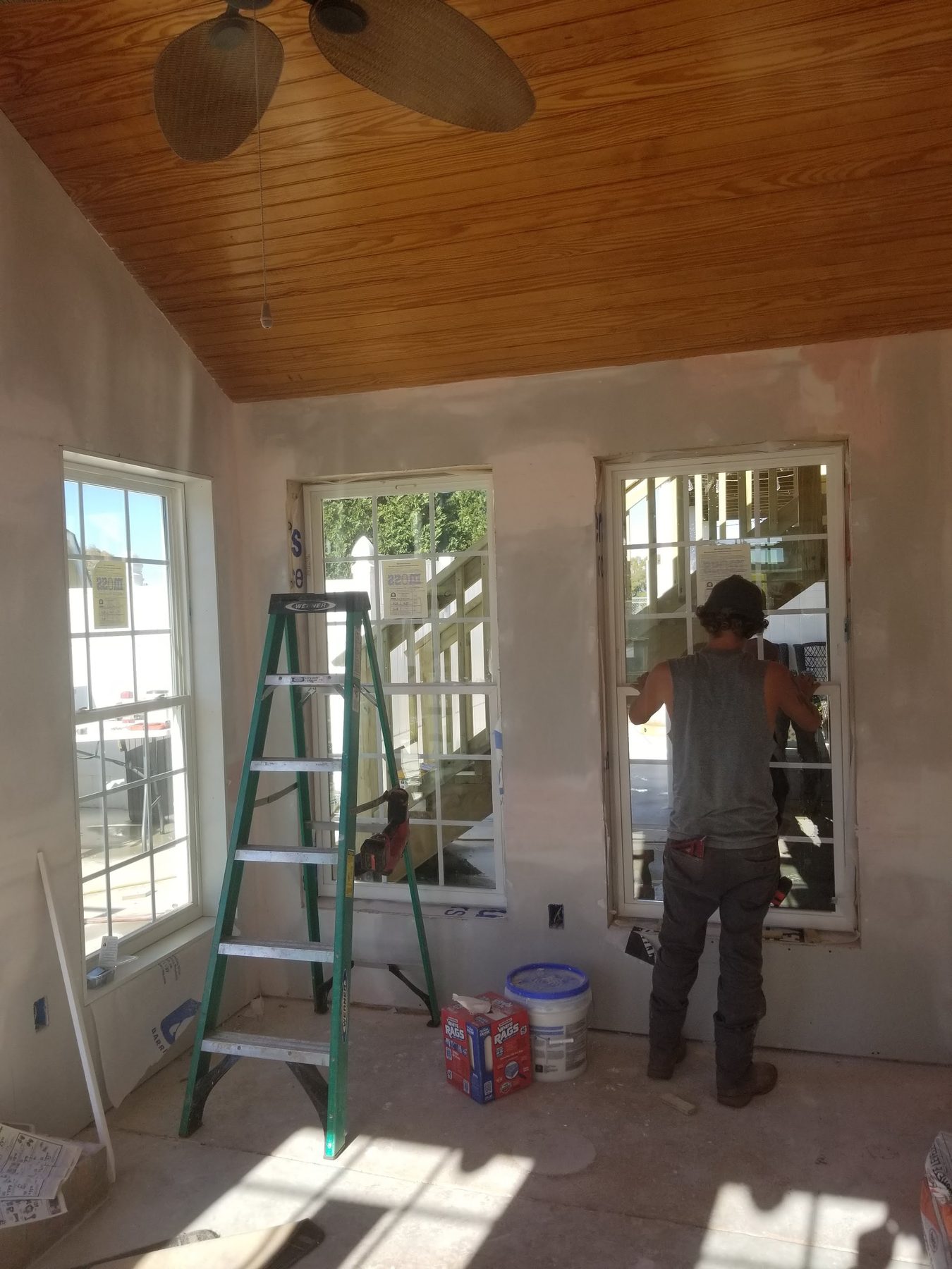 Tessco Construction crew finishing interior trim and paint